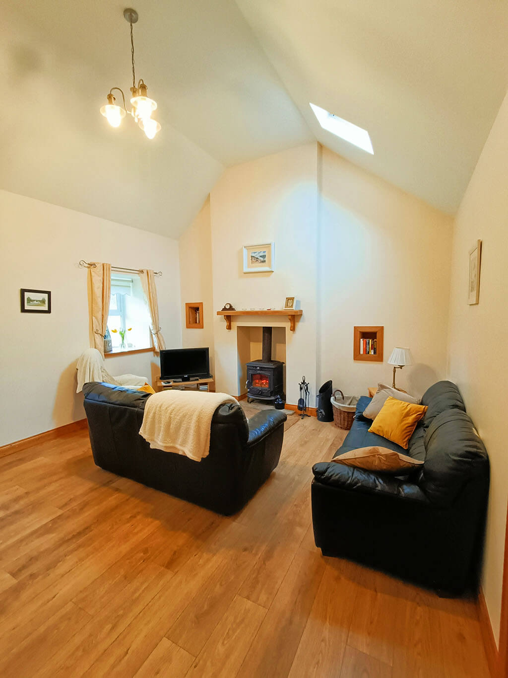 living-room-sofa-blanket-window-roof-stove-fire-wooden-floor-decoration-cosy-cozy-warm-high-ceiling-cushion